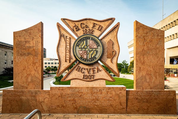 The Baltimore County Fire Department's logo on a statue of a patch in the daytime.