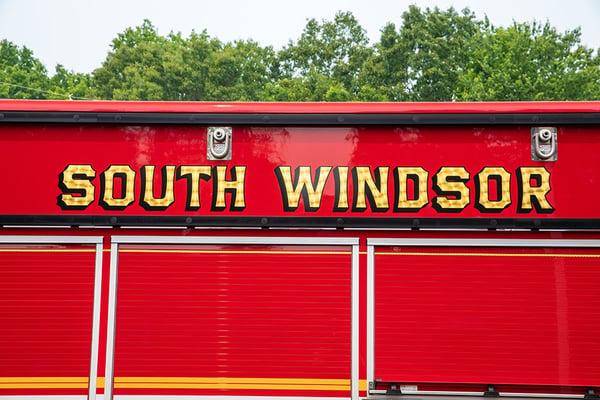 The fire department graphic above the body compartments of a fire truck.