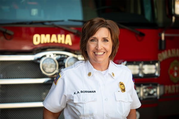 The Omaha Fire Chief posed in front of fire truck