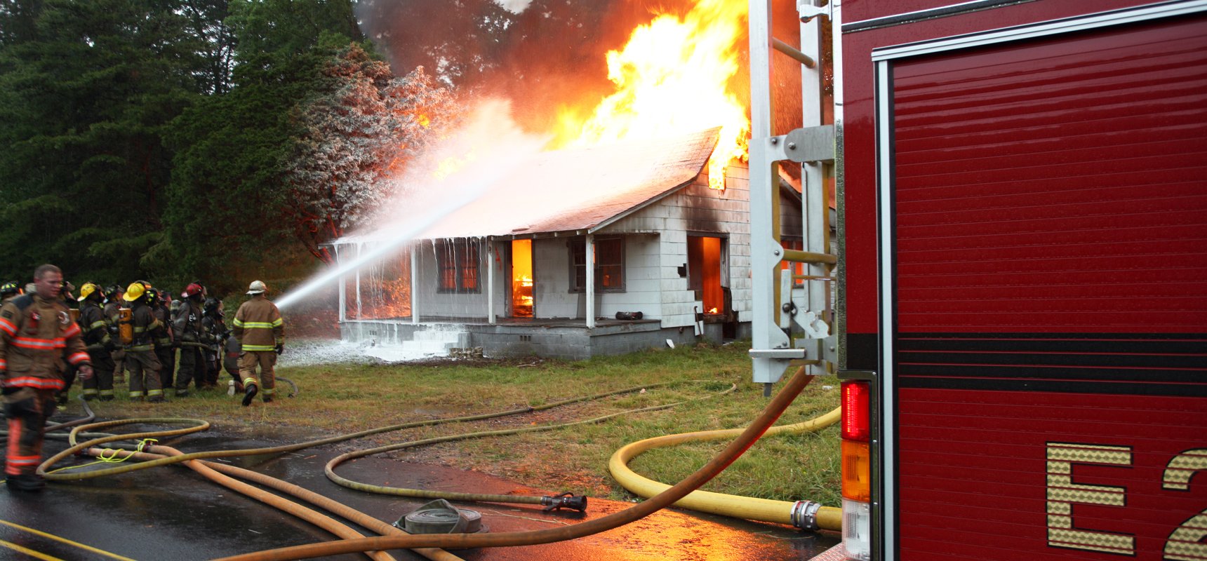firefighter fighting fire with hose