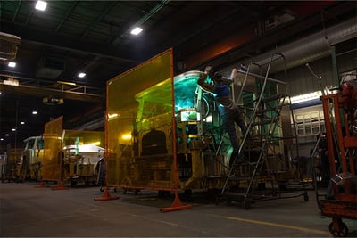 A fire truck being welded during the fire truck metal fabrication process.