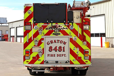 The rear end of the Graton Volunteer Fire Department Engine 8481 shows the red and neon chevron stripping and the notched-out ladder placement. 