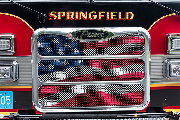 Fire truck grille of Springfield Fire and Emergency Serivces with an American flag.