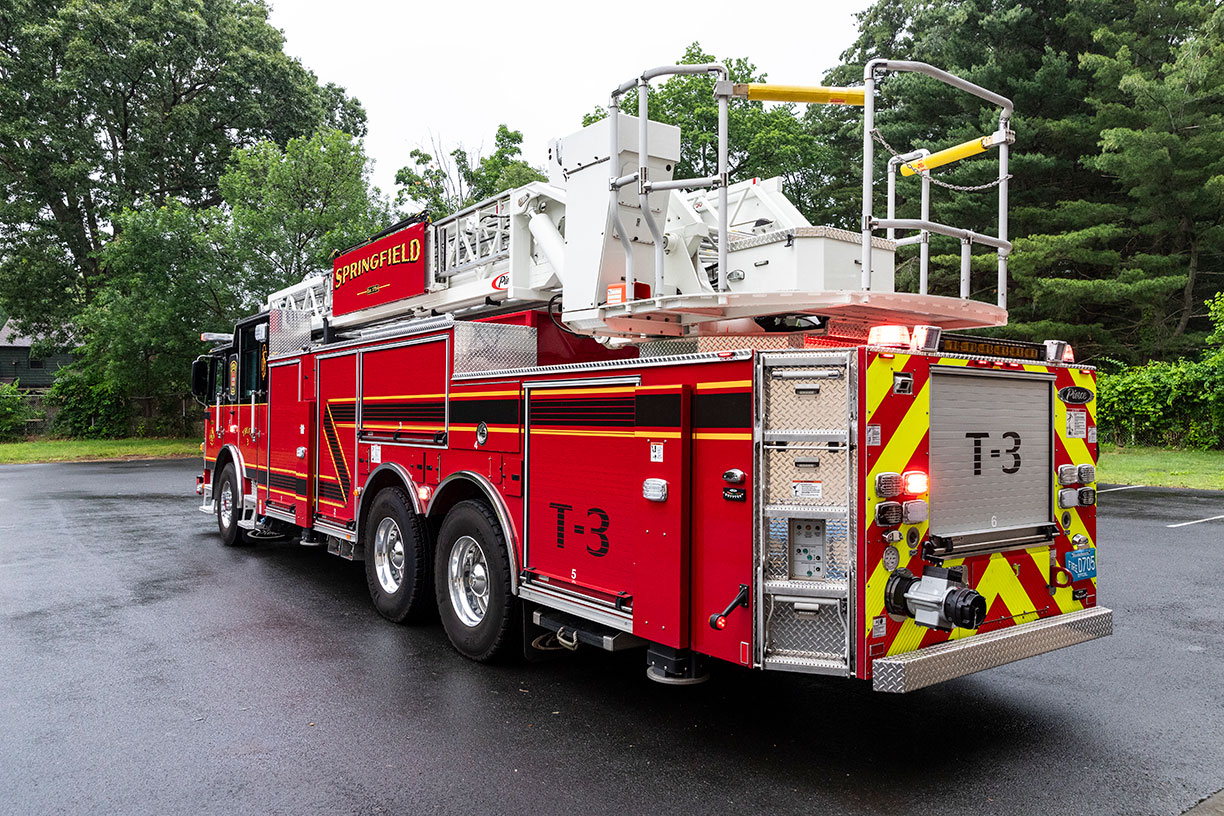 The Driver's side rear of a 100' Heavy-Duty Low-Profile Steel Aerial Ladder.