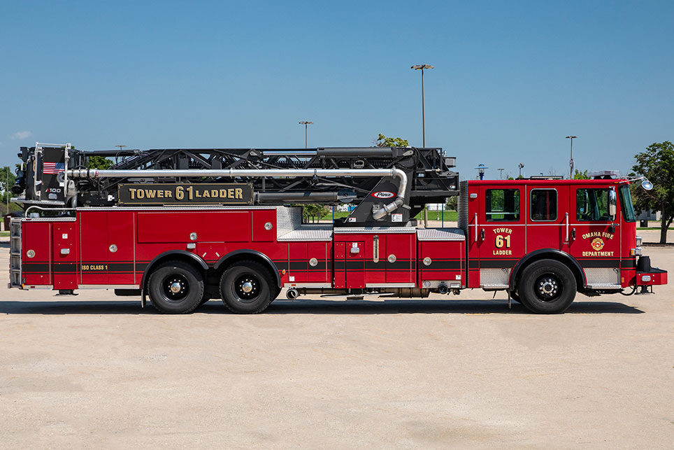 The officers side of an Enforcer Ascendant 100  Aerial Tower in a parking lot on a sunny day.