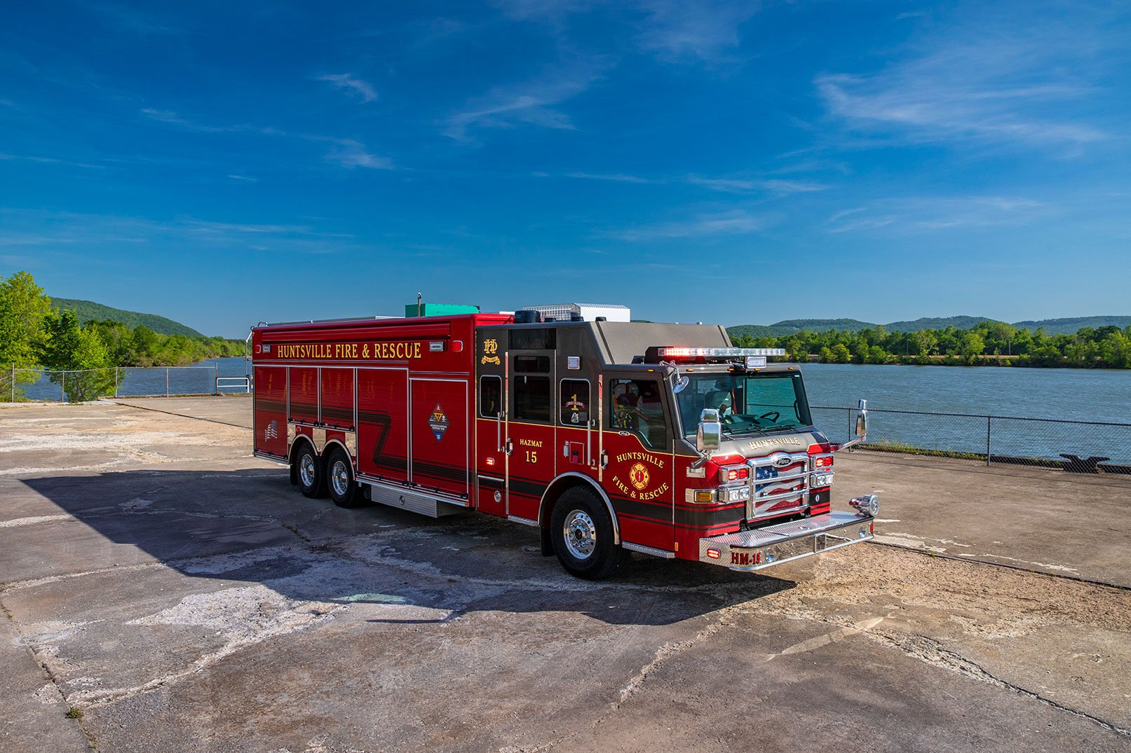 Huntsville Fire & Rescues Velocity Heavy-Duty Rescue parked in front of a lake on a sunny day.